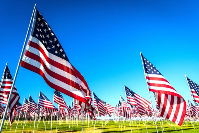 A large group of American flags. Veterans or Memorial day display
